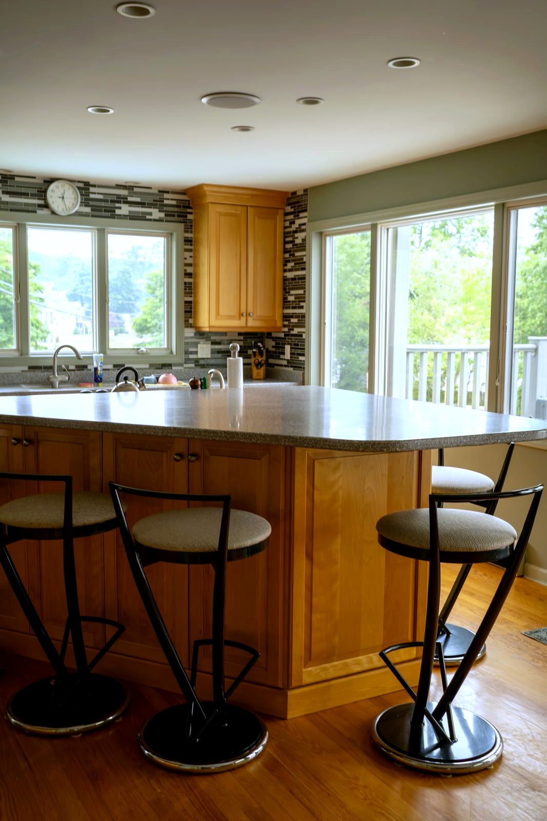 Kitchen island with bar seating and lake windows