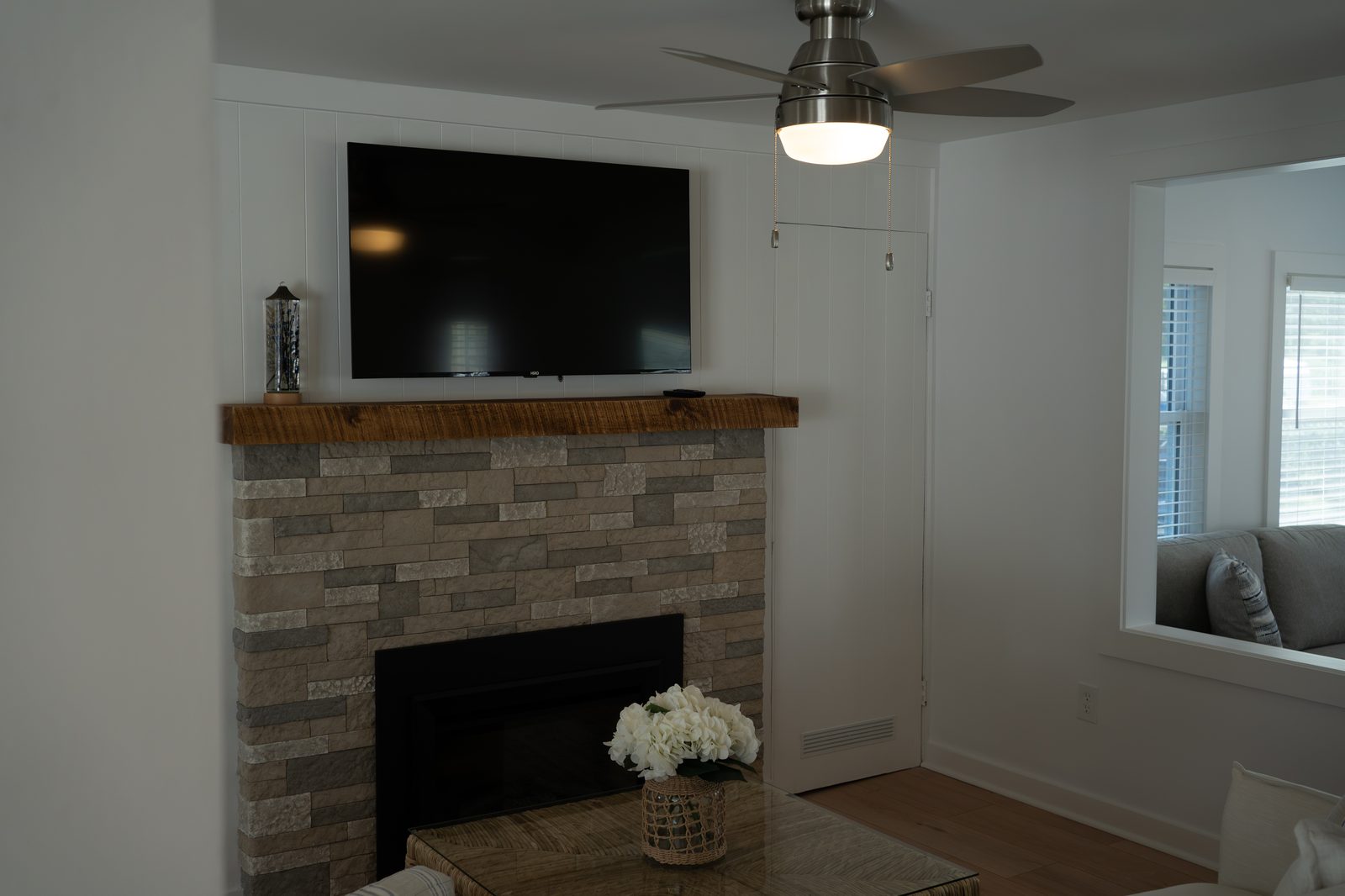 Living room with stone fireplace